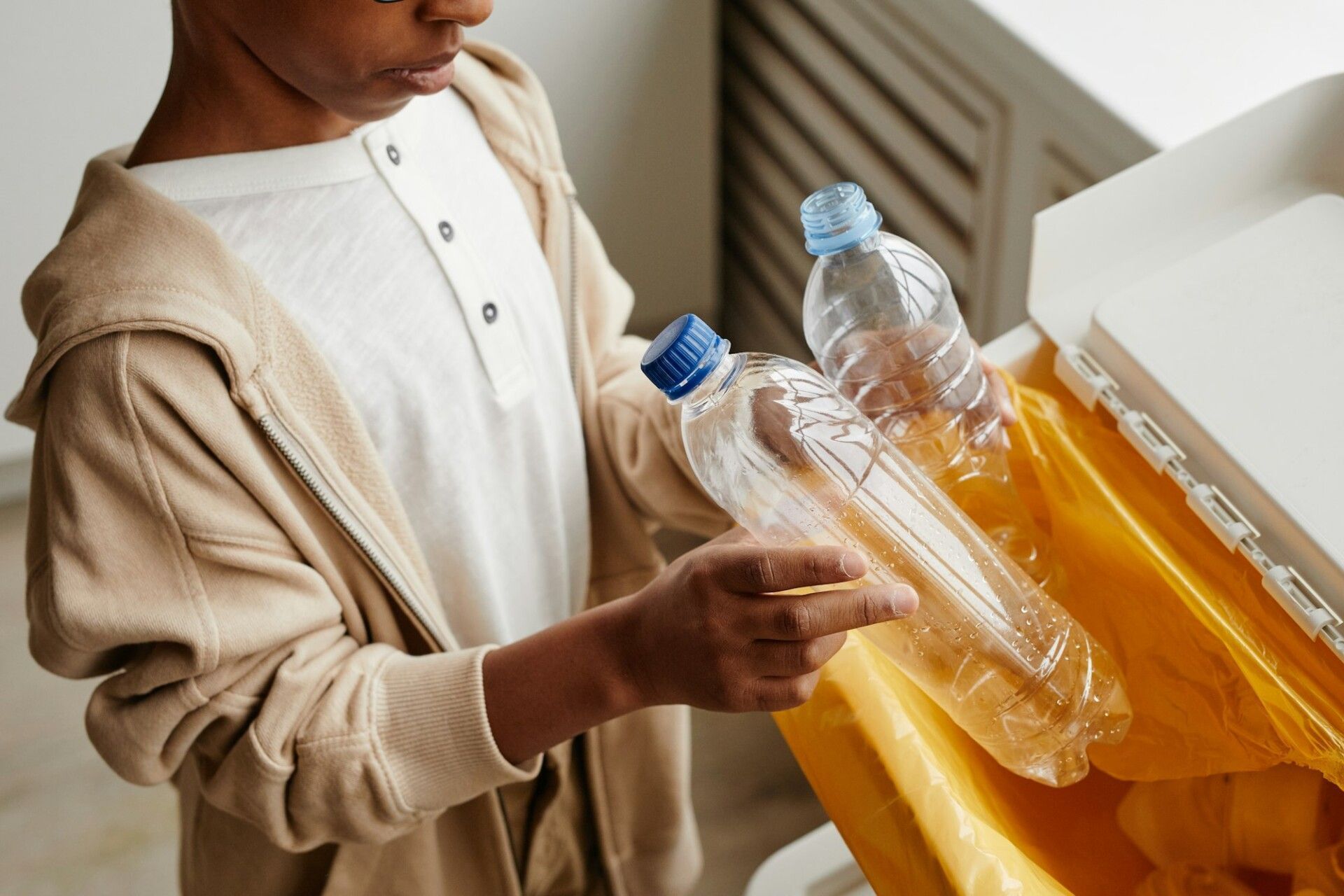 Boy Sorting Plastic Close Up